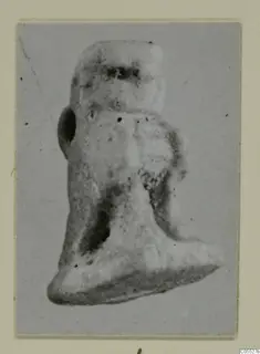 Small figurine from Amathus, shown in a photograph mounted on grey card
