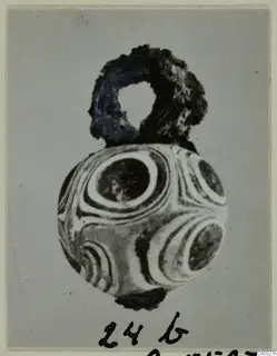 Round bead with concentric ring pattern and a loop at the top, from Marion Tomb 92