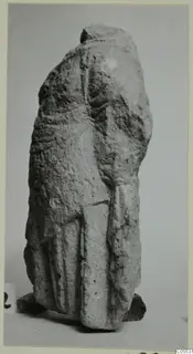 Limestone sculpture fragment of a draped standing figure from Mersinaki, top broken away