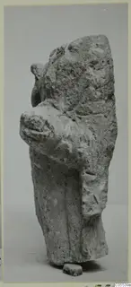Limestone sculpture fragment of a figure from Mersinaki, with a bent arm and a small base