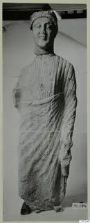 Limestone statue of a standing figure in a long draped garment, from Mersinaki