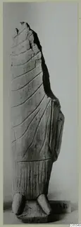 Limestone sculpture fragment from Mersinaki, a standing figure with broken top and incised drapery lines