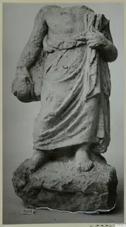 Headless, armless draped statue of a standing figure on a rough rock base, from Mersinaki