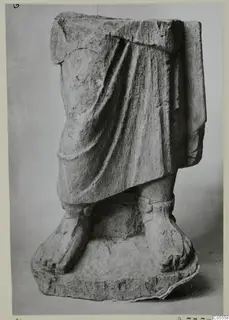 Statue fragment from Mersinaki: draped lower body and feet on a rectangular base.