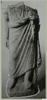 Stone statue of a draped standing figure from Soli, head and one arm missing