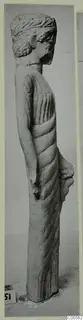 Limestone statue of a standing figure from Mersinaki, seen in profile.