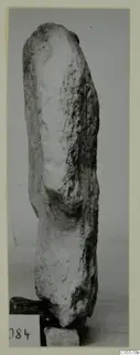 Limestone sculpture fragment from Mersinaki, standing upright against a plain grey backdrop