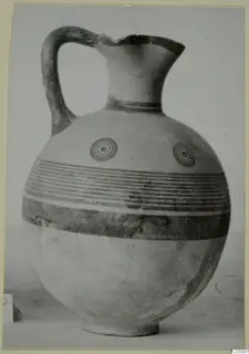 Pottery Black-on-Red I-III jug from Marion, with a loop handle, concentric circle motifs and horizontal bands