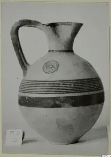 Black-on-Red jug from Marion, with dark painted bands and a concentric-circle motif on the shoulder
