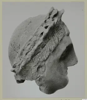 Stone head in right-facing profile with a raised band across the hair, from Mersinaki