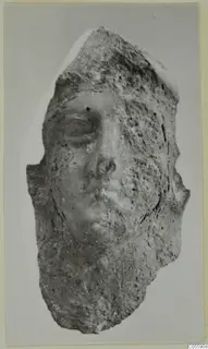 Terracotta head fragment from Mersinaki, showing a worn face with an eye, nose and mouth in low relief