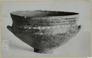 Bichrome-Red bowl with two small lug handles and a row of pale dots around its body