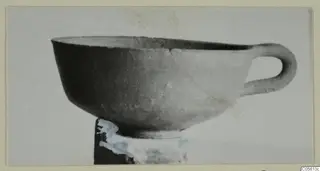 Pottery Plain White IV-V bowl with a single loop handle, from Marion, finds from tombs 61–98