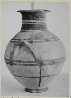 White Painted I amphora with dark painted bands, a lattice motif on the shoulder and a strap handle