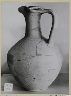 Jug of Pottery Red Slip I_III - V_VII from Amathus, with a strap handle and cracks across the body