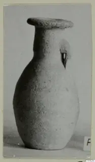 Pottery Plain White IV-V juglet with a flat rim and one loop handle, from Amathus tombs