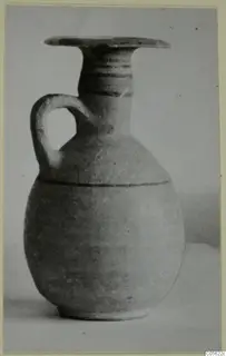 Jug from Amathus with a flaring rim, one loop handle and dark bands on the neck and body.
