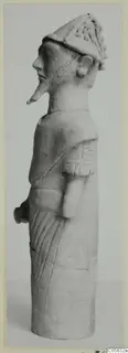 Terracotta figure in side view, with a tall peaked headdress and a long pointed nose