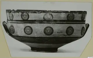 Pottery Black-on-Red II-IV bowl with a pattern of concentric circles and two side handles
