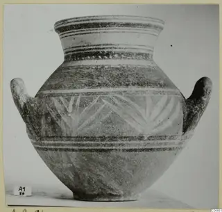 Two-handled vessel with painted horizontal bands and a leaf-like pattern on the body, from Amathus