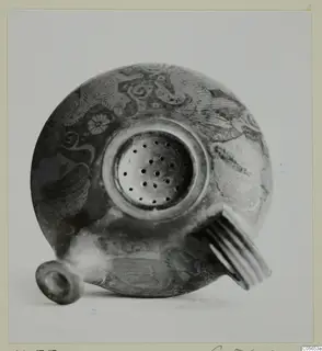 Round painted vessel with a perforated top and ribbed handle, from Marion