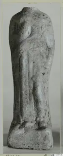 Headless terracotta figurine of a standing figure on a rectangular base, with traces of blue paint