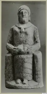 Seated limestone statuette of a figure with hands clasped in its lap, from Marion tombs 46–60