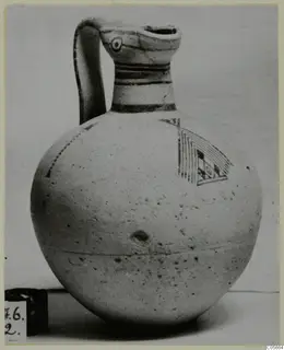 Pottery Bichrome III jug with a strap handle and painted bands
