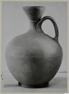 Jug of Stroke Polished Ware with a funnel-shaped mouth and single loop handle, from Marion tombs 46–60