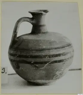 Jug with one handle, a flaring neck and dark horizontal painted bands, from the Marion tomb finds