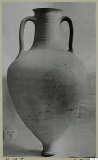 Pottery Plain White VI amphora from Marion with two handles, photographed against a draped cloth
