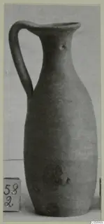 Plain White VI jug with a single strap handle, a tall narrow neck and a rounded body, shown against a light backdrop.
