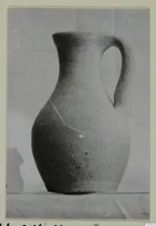 Pottery Plain White VII juglet from Marion, with a single loop handle, photographed against a plain backdrop.