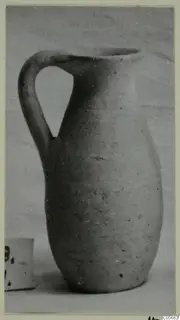 Pottery jug, Plain White VI, with a single loop handle, photographed against a pale background.