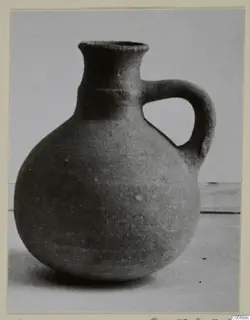 Pottery Red Slip jug from Amathus tombs 10–26, with a round body and a single loop handle.