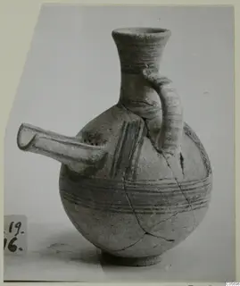 Pottery Bichrome II strainer vessel from Amathus, with a tubular spout and painted bands