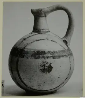 Jug in Pottery Bichrome V from Amathus, with a single strap handle and dark painted bands