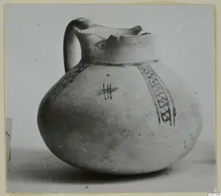 White Painted IV jug from Amathus with a single loop handle and painted bands on a globular body