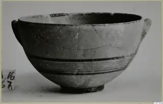 Bowl from Amathus in Black-on-Red I-III ware, with dark horizontal bands around the body and small handles at the rim.