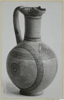 Painted jug with one handle, dark bands, concentric circles and a hatched triangle, from Amathus tombs