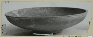 Shallow bowl with a flaring rim and low foot, side view, from the Amathus tombs 1–9 finds.