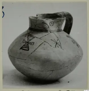 Pottery Bichrome IV jug from Amathus, with dark painted triangles and motifs on a rounded body