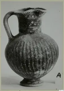 Black Slip jug from Amathus with a loop handle and vertical grooves on the body