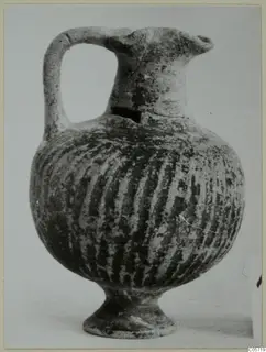 Black Slip I-VI jug from Amathus with a single loop handle and vertical striped decoration