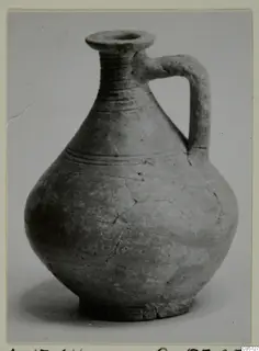 Pottery jug with a single strap handle, a flared mouth and incised lines on the body, from Amathus
