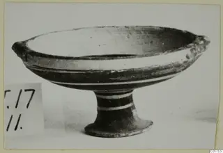 Pottery Bichrome IV plate-jug, a shallow footed bowl with pale bands, shown in profile