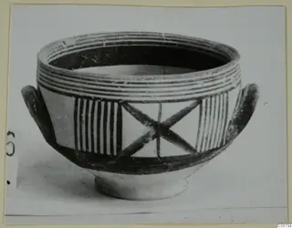 Pottery bowl with two small loop handles, painted with bands, vertical stripes and a cross pattern on the body.
