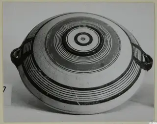 Pottery Bichrome III flattened vessel with concentric circle decoration and two loop handles