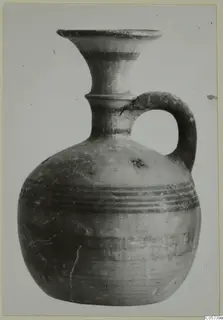 Pottery Black-on-Red I-III juglet from Amathus, with a flaring mouth, ridged neck and strap handle