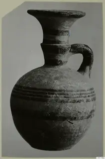 Pottery Black-on-Red I-III juglet from Amathus with a flaring rim, one handle and dark horizontal bands